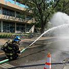 Firefighter spraying water