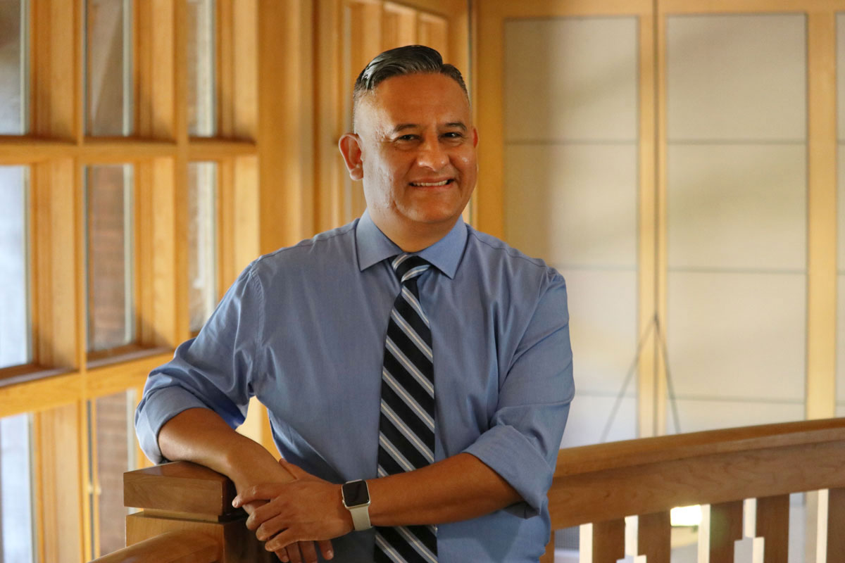 Pablo G. Reguerin in casual pose in Dutton Hall.