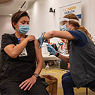 Woman receives vaccine.