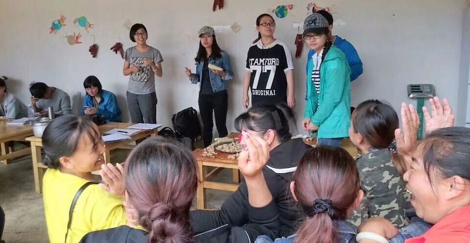 A group of farmers, consumers, and NGO practitioners investigating a CSA farm in a Bai village, southwest China.