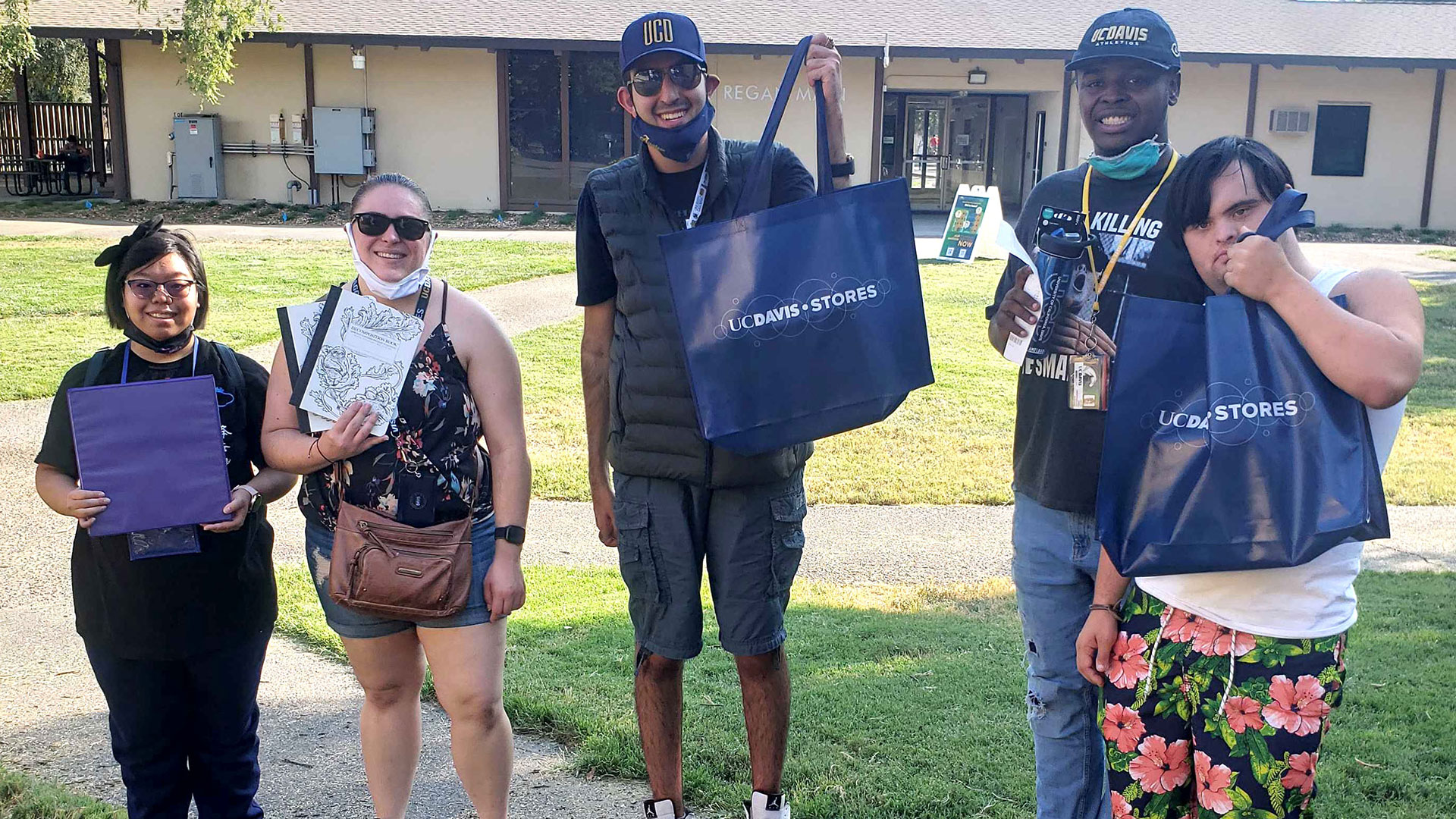 Scholars Karis Chun, Olivia Adams-Falconer, Kai Gardizi, Jaylen Parks and Ryan Fitch gather after practicing their route to and from key places on campus.