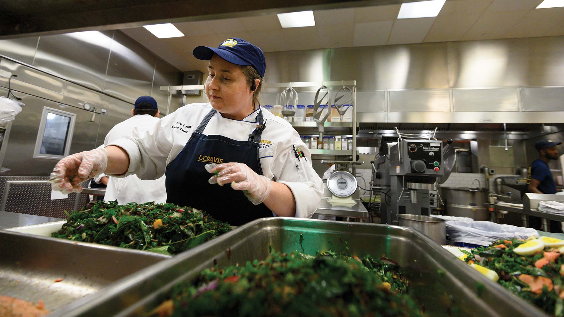 A chef prepares fresh greens