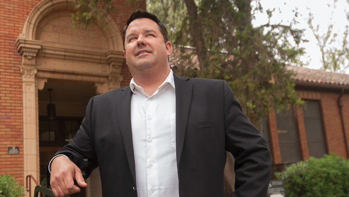 Mike Webb stands in front of the Davis City Hall