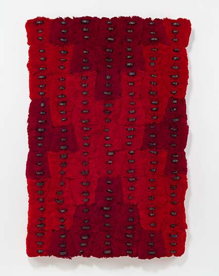 Fragment (To Gather), 2023. Thread, thread cores, staples, wax on wood panel. 63 x 42 x 6 in.