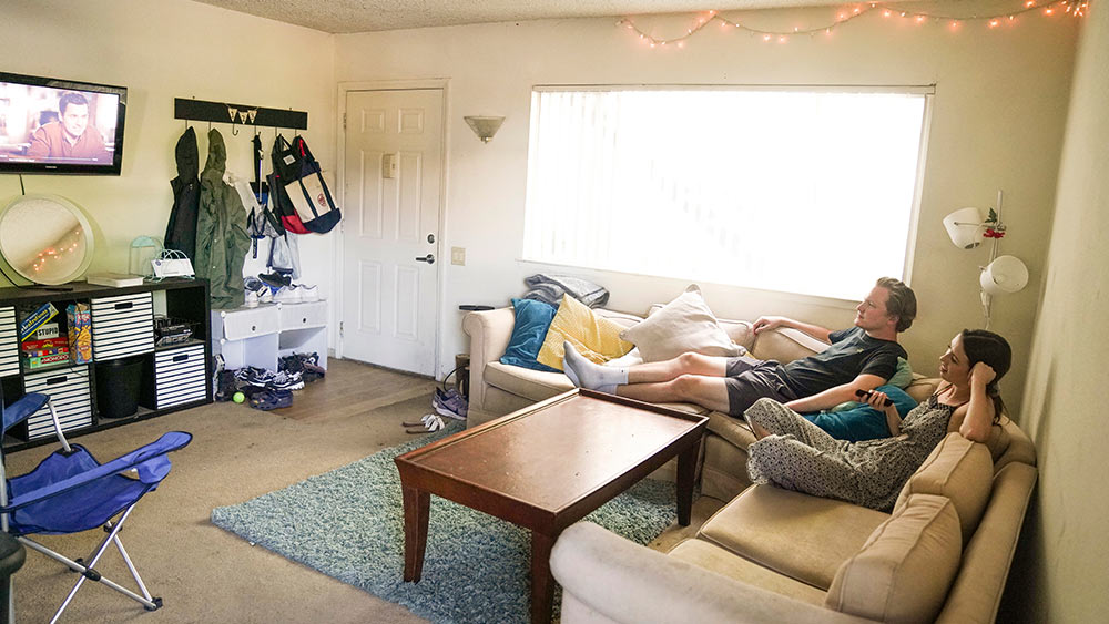 students relax on couch 