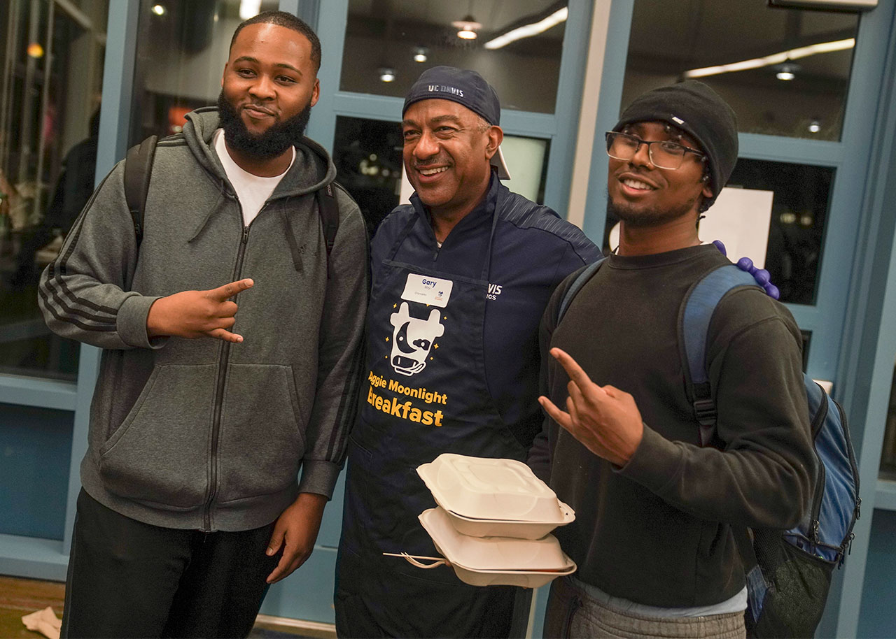 Students pose for photo with Chancellor May