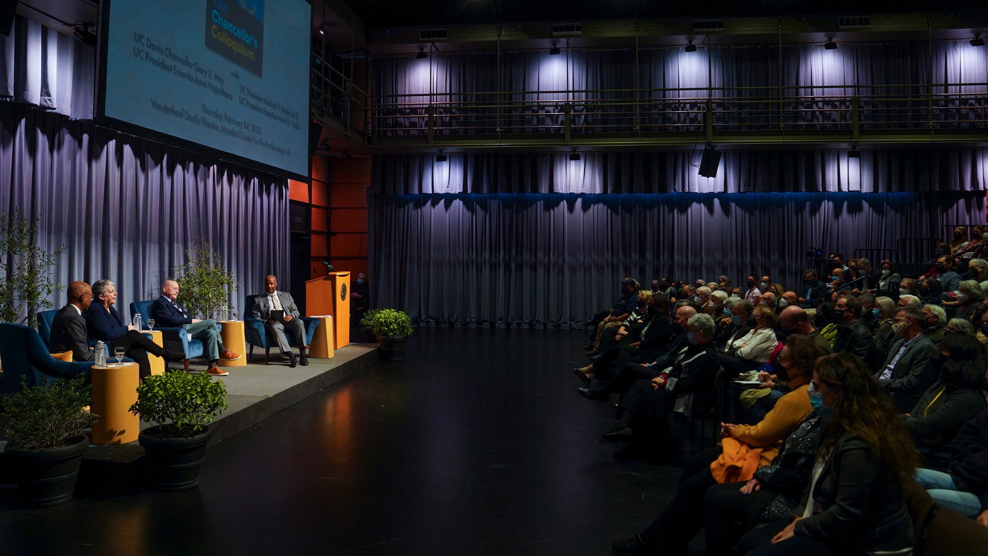 Stage party and audience at Chancellor's Colloquium