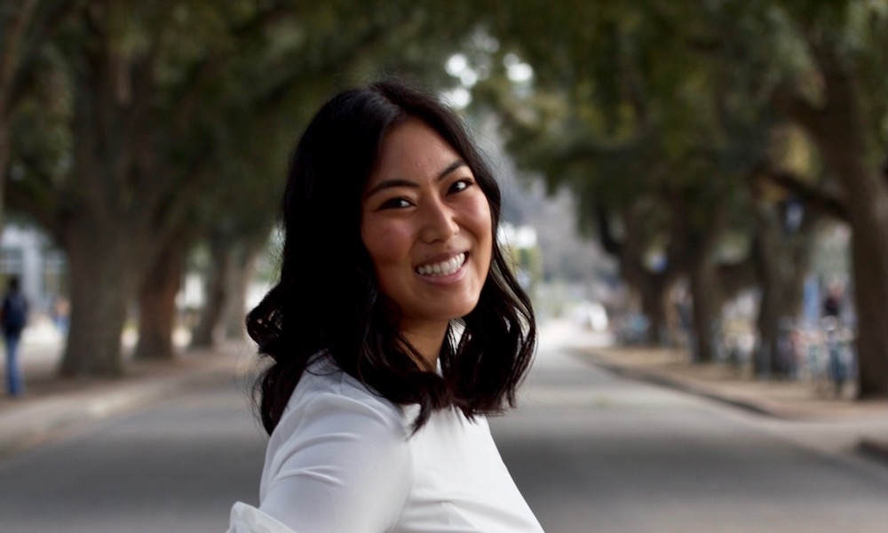 Char poses in front of the trees at UC Davis. 