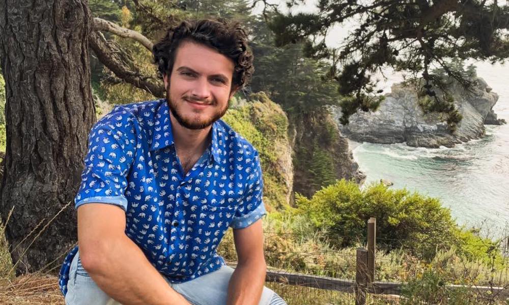 Erik poses in front of a cliff, he's an education minor at UC Davis. 