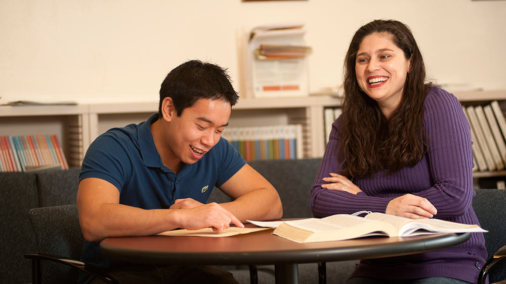 student receives guidance from adviser 