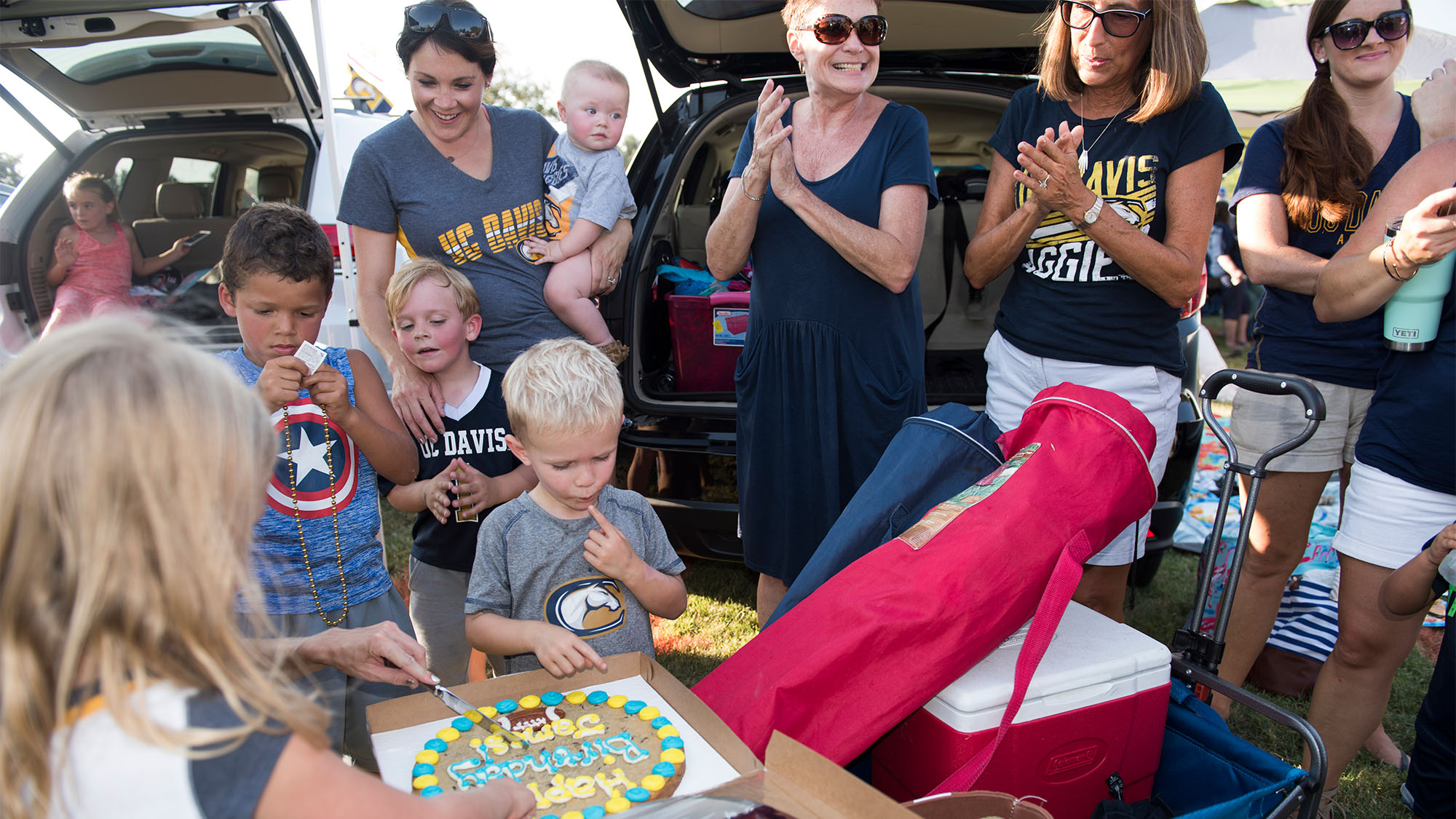 Family tailgates at football game.