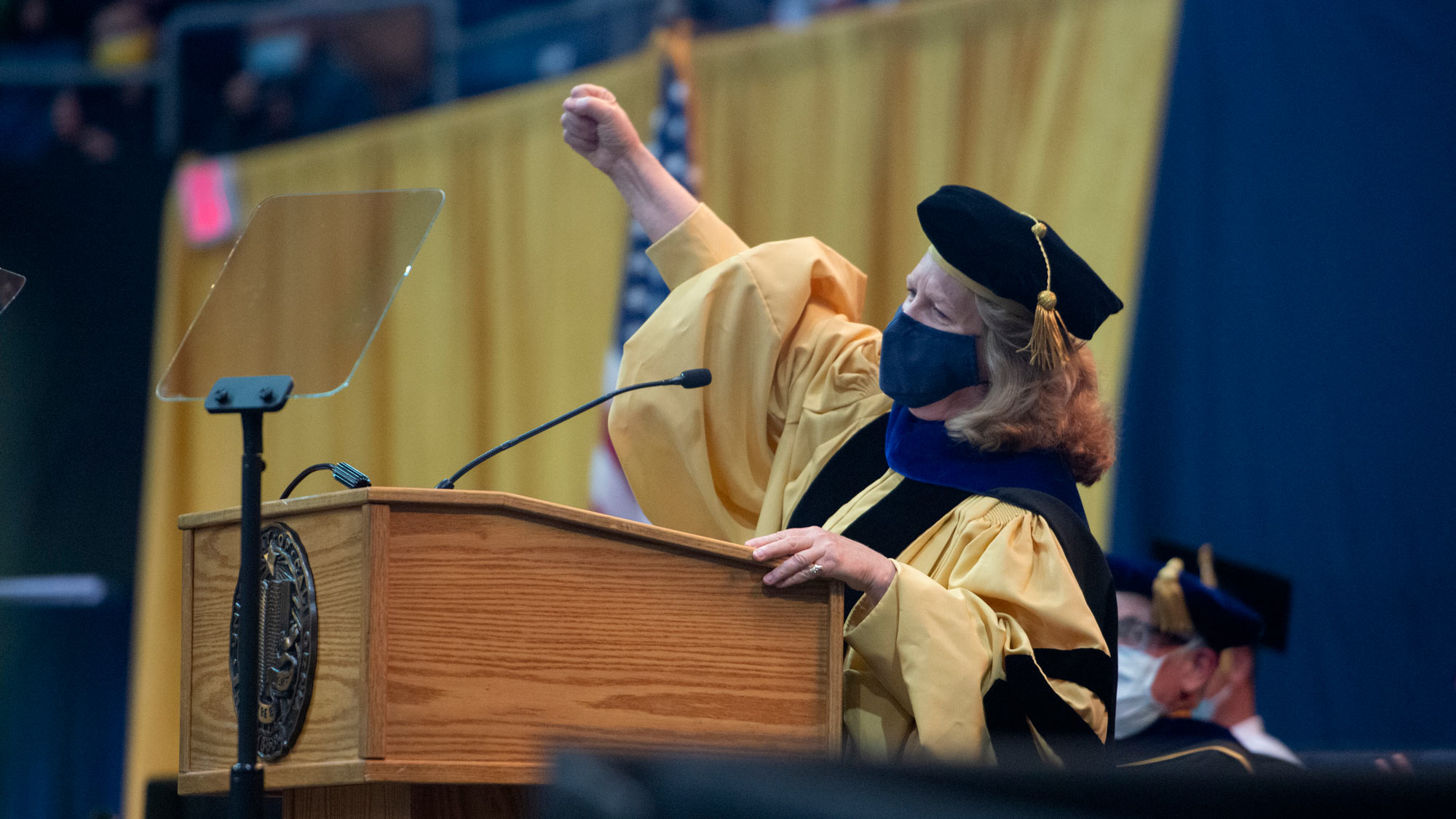 Provost pumps fist in "Go Ags!" cheer.