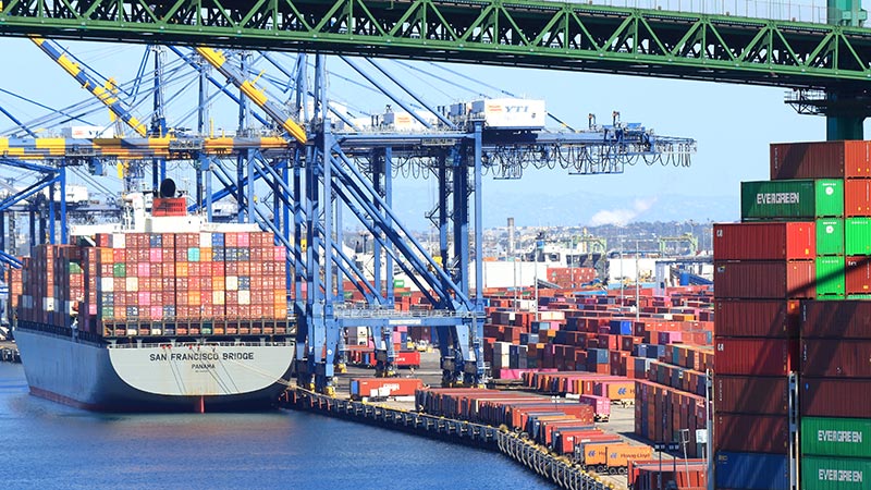 Container ship in port being loaded