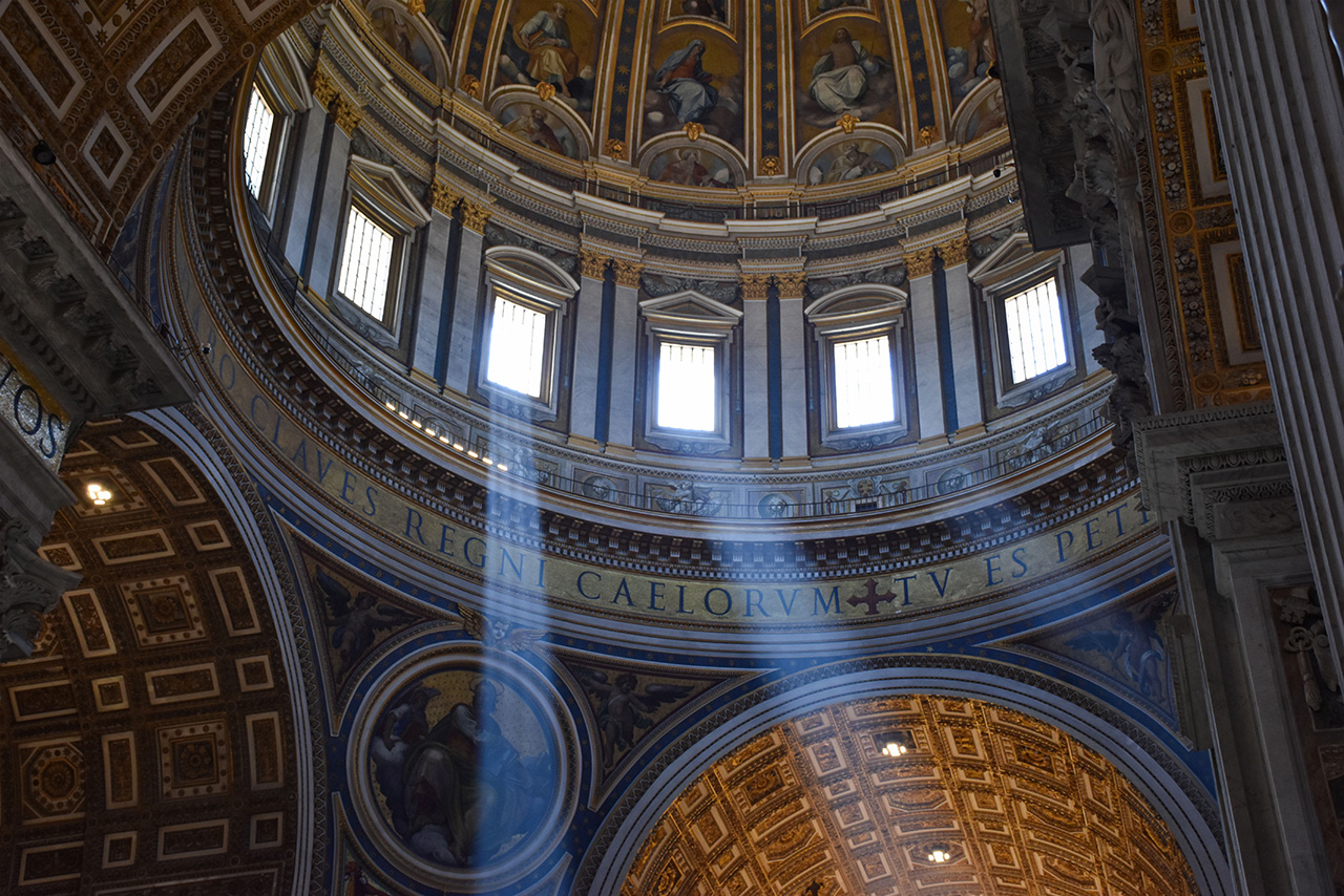 Light comes in through windows of cathedral.