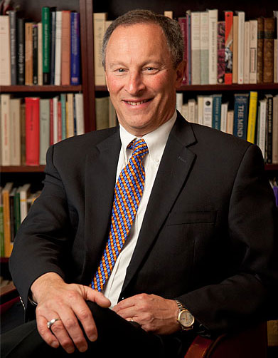  Ralph J. Hexter in front of bookcase