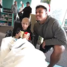 Arik Armstead with a child.