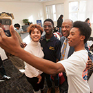 A student takes a selfie with Chancellor Gary S. May.