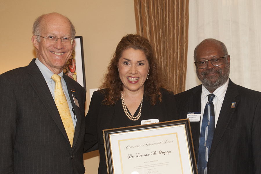 Lorena Oropeza, flanked by ken Burtis and Rahim Reed