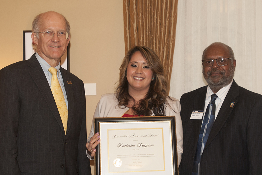 Katherine Parpana flanked by Ken Burtis and Rahim Reed