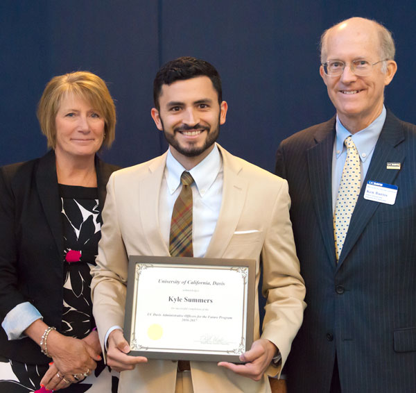 Kyle Summers holds certificate.