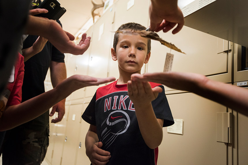 Boy waiting to hold a bat