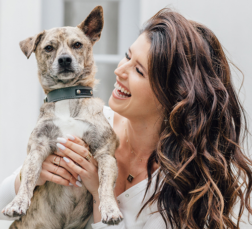 Katherine Schwarzenegger holds up Maverick.