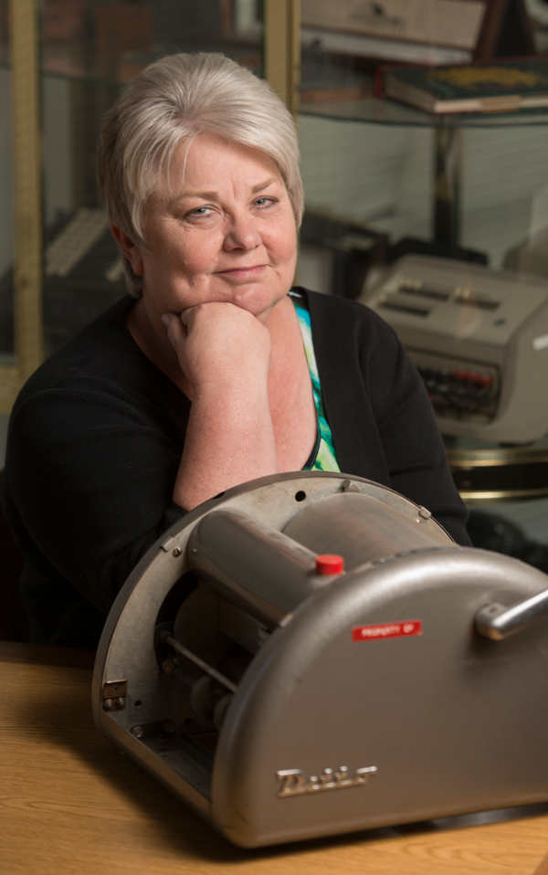 Kerie Holck poses with old Ditto machine.