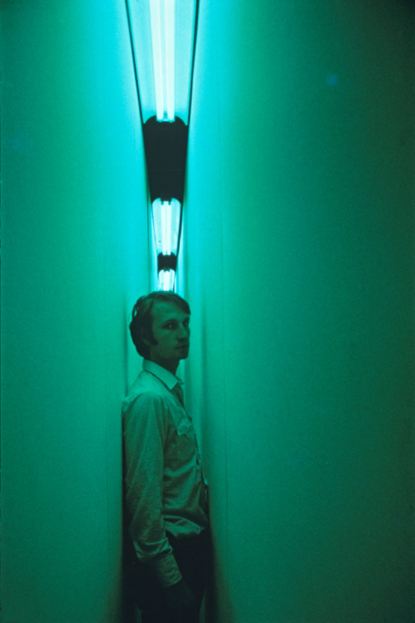 Nauman in green-lit corridor