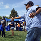 Man throws a beanbag at UC Davis TGFS.