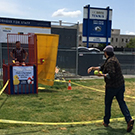 Joe Proudman throws at the dunk tank at UC Davis.