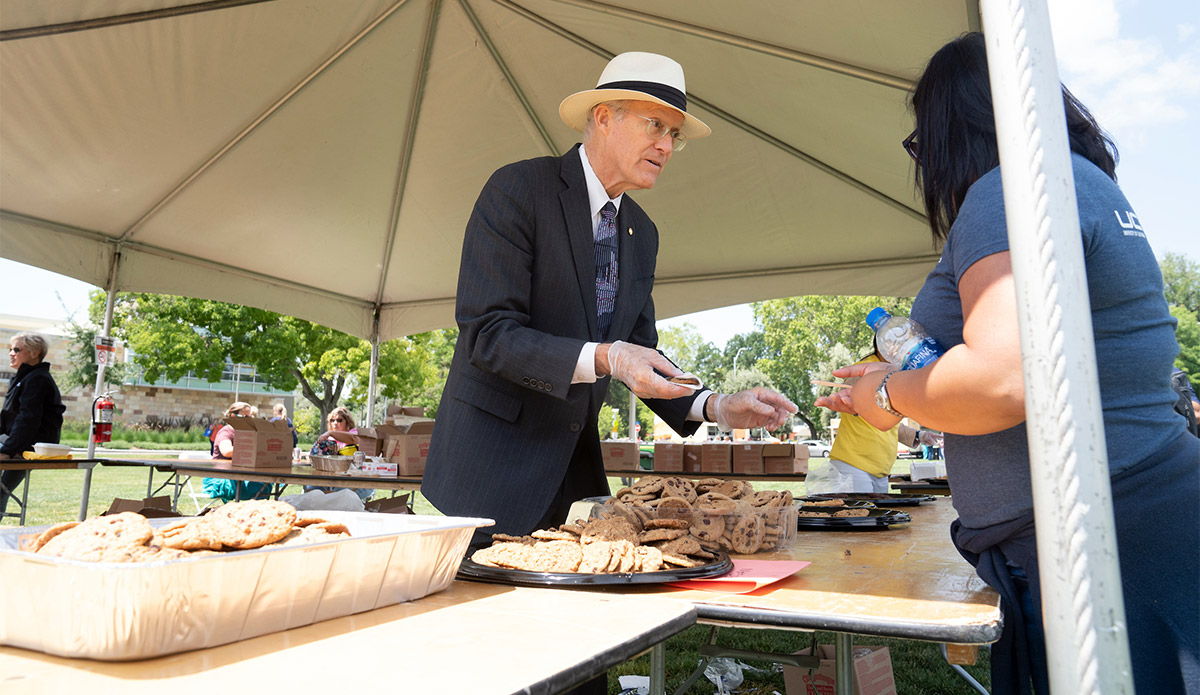 Ken Burtis gives out cookies at TGFS.