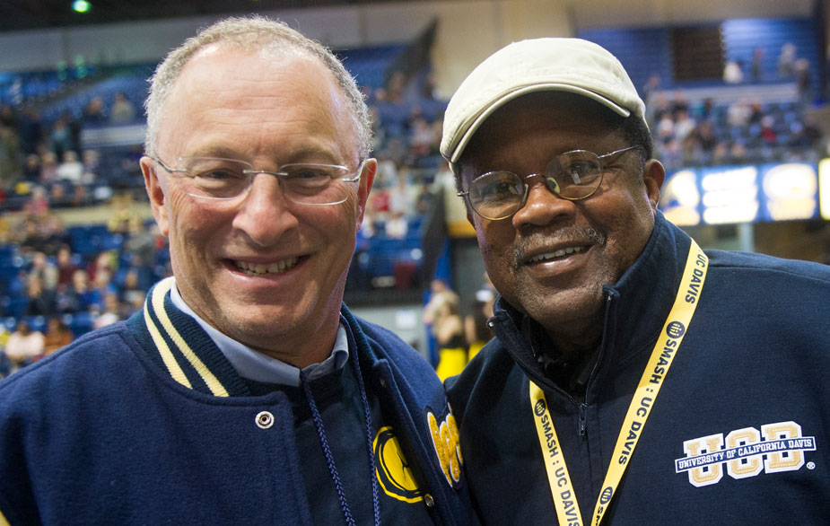 2 men side by side, in UC Davis jackets