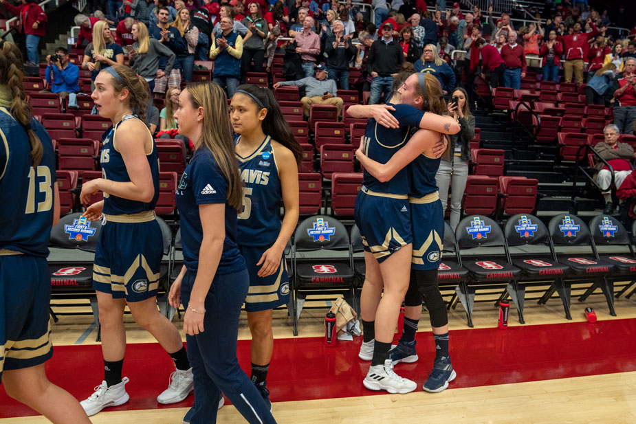 Players embrace on the court.