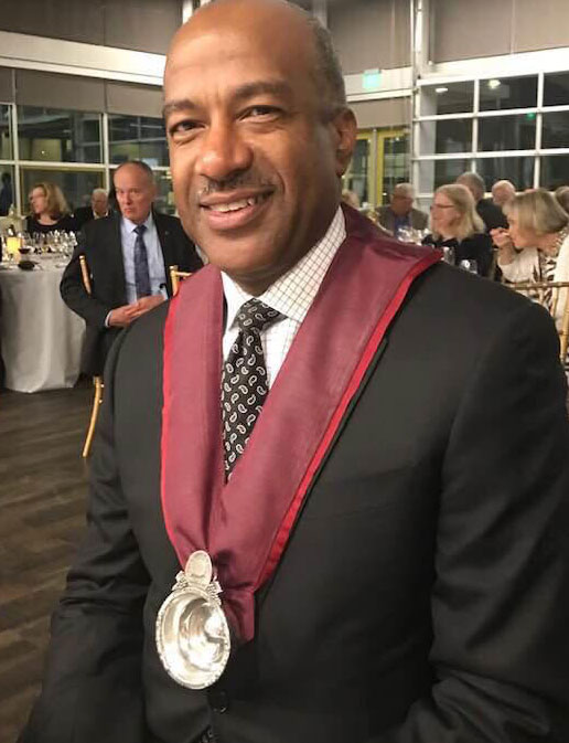 Chancellor Gary S. May, wearing chevalier ribbon with tastivin.