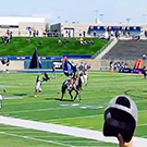 Maggie the Aggie on the football field.