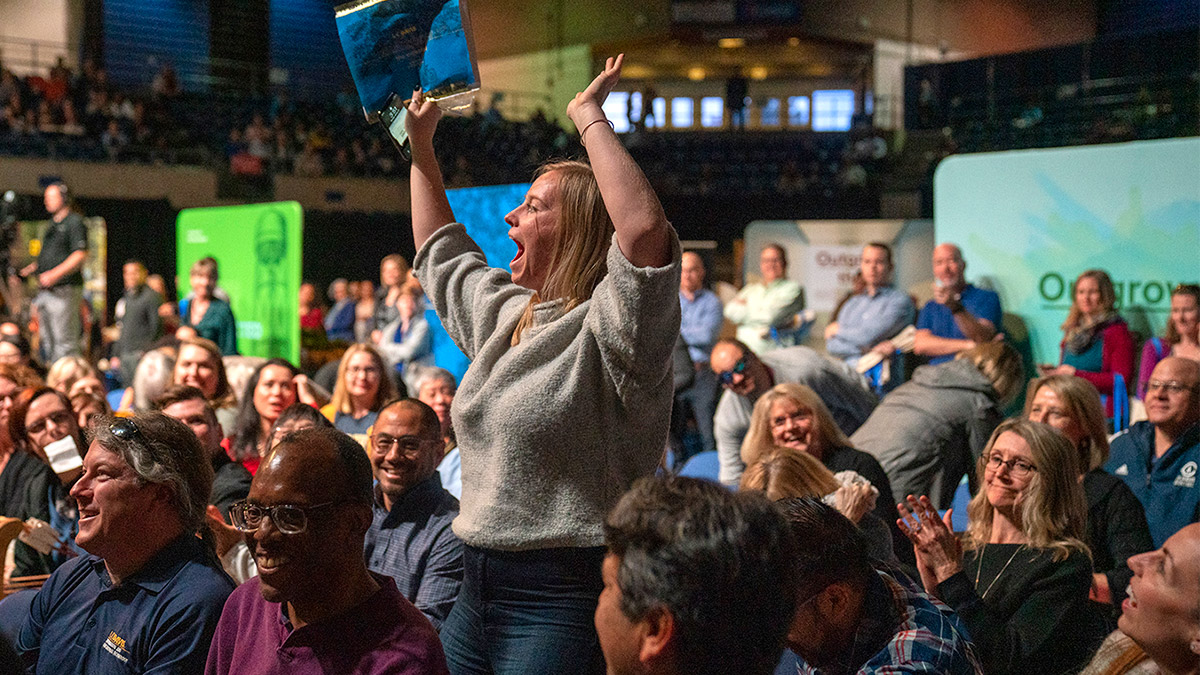 Woman reacts to winning a prize.