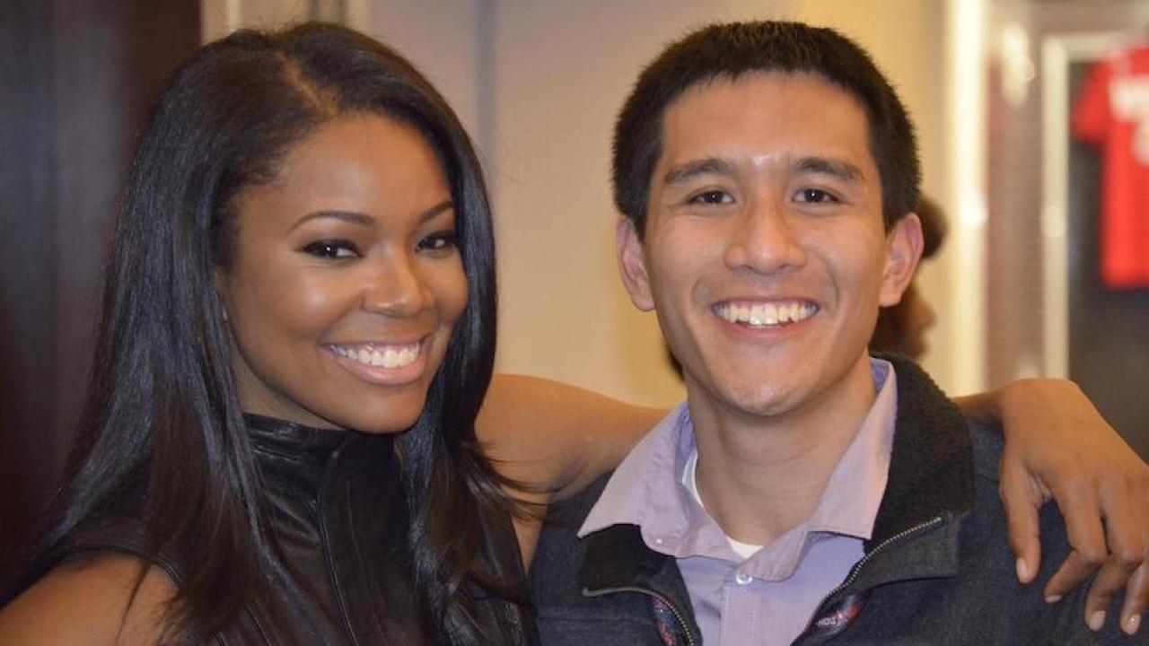 Jon Santiago meeting actress Gabrielle Union at 2013 NBA All-Star Weekend in Houston.  