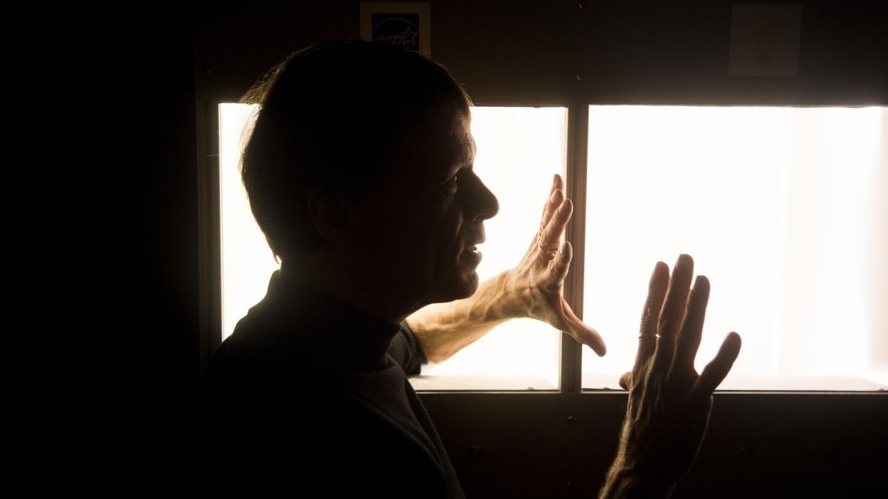 Man by lighting display