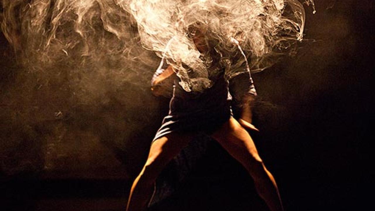 Stylized photo of a man that looks like his head and torso are burning.

