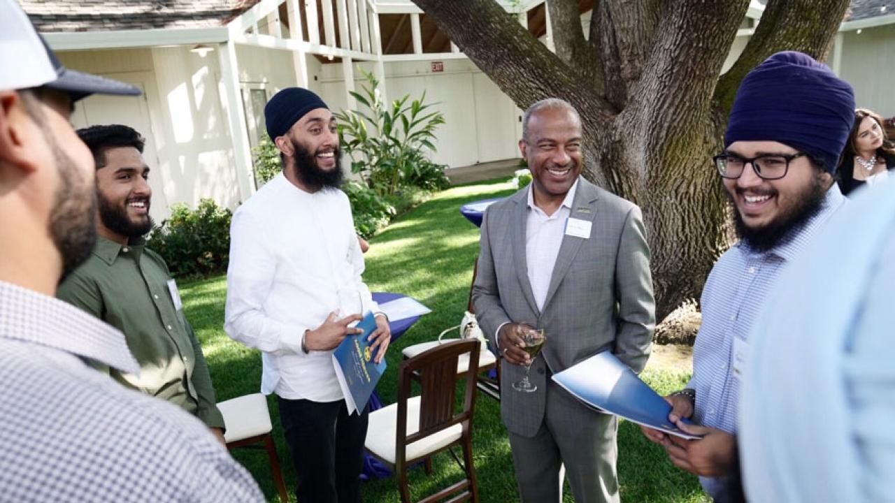 Chancellor May in a conversation circle with members of the Sikh Cultural Association, at reception