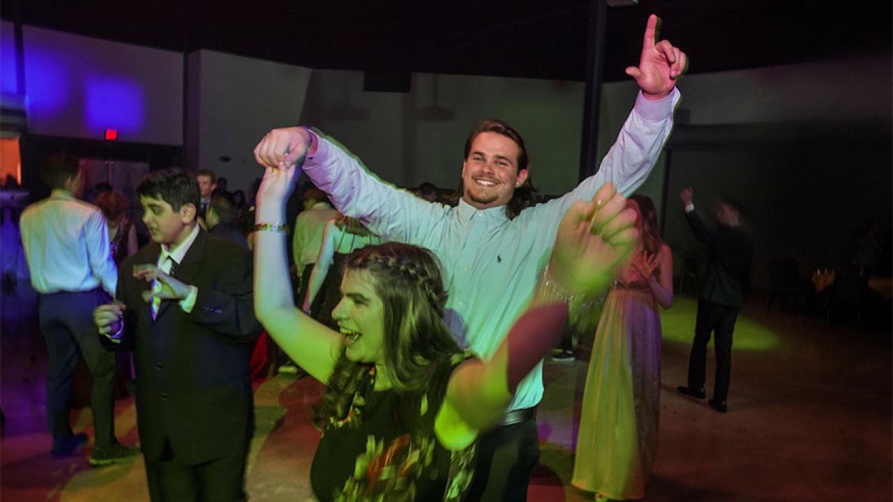 A young man and woman dancing