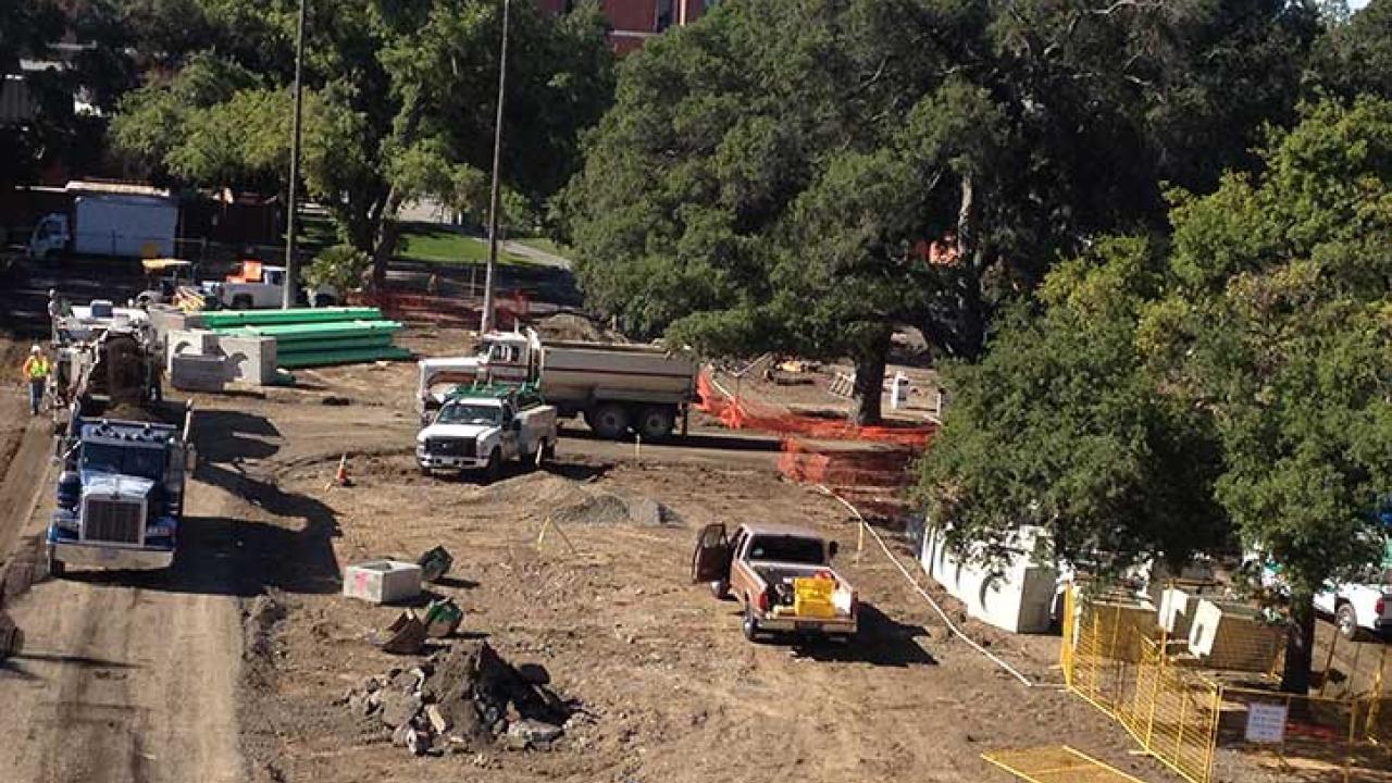Photo: Tractors and dump trucks at construction site
