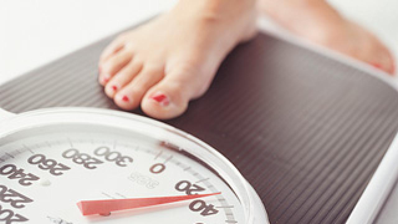 Photo: foot stepping on a scale