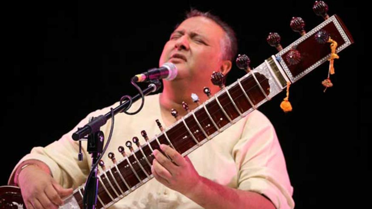 Shujaat Khan, singing, playing sitar.