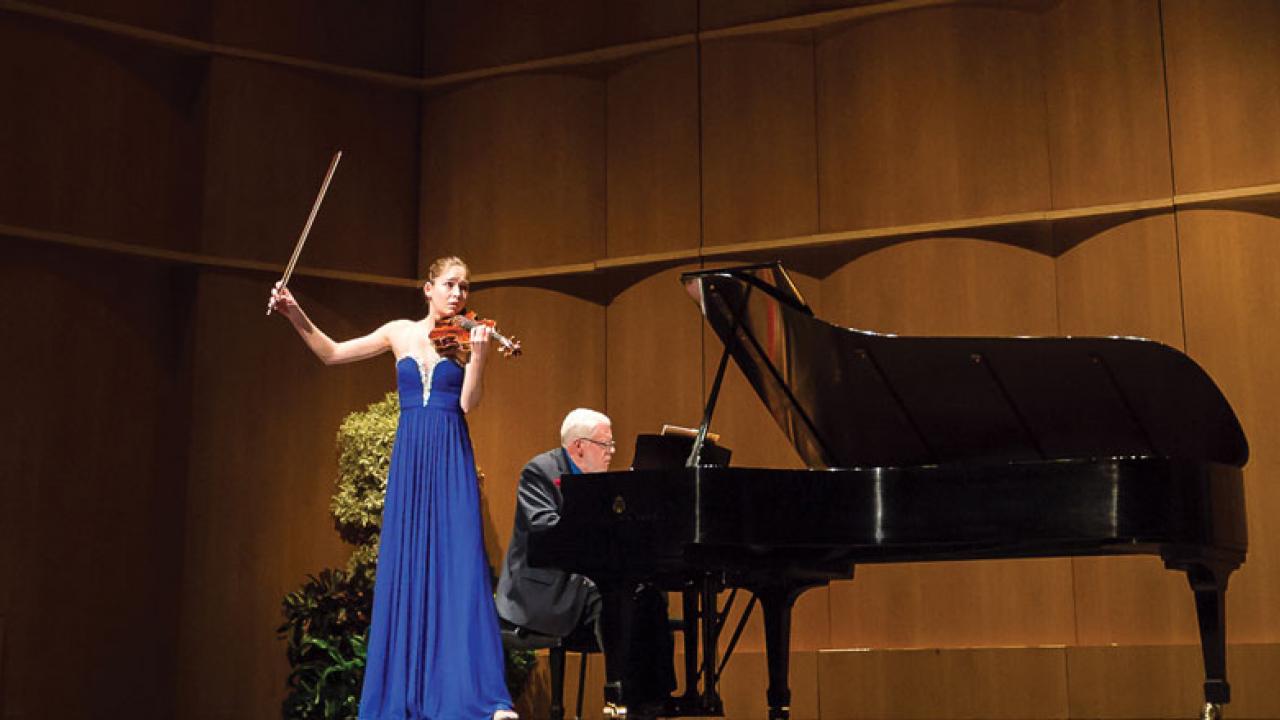 Violinist performs.