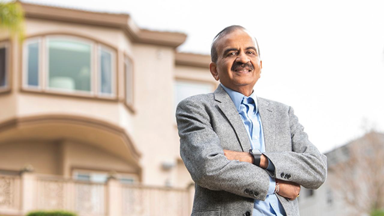 Prem Jain outside in front of his house