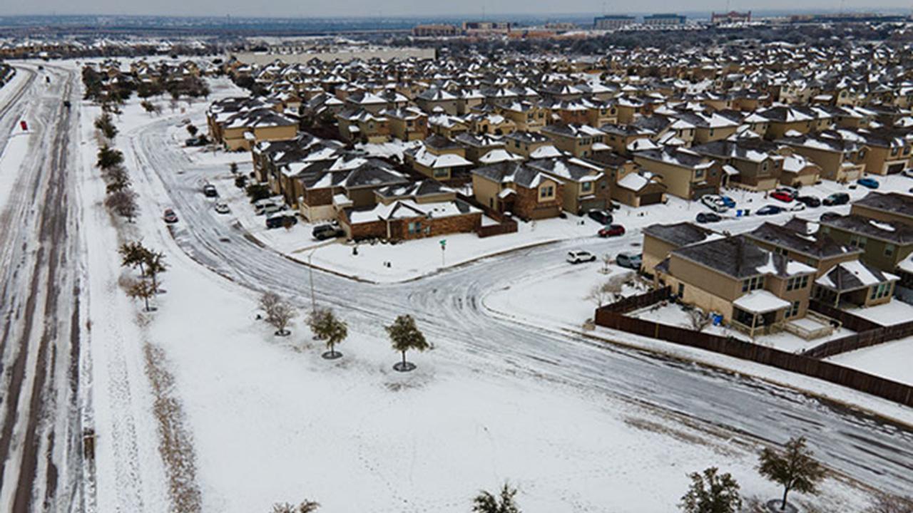 Austin suburb seen from above with snow on the streets