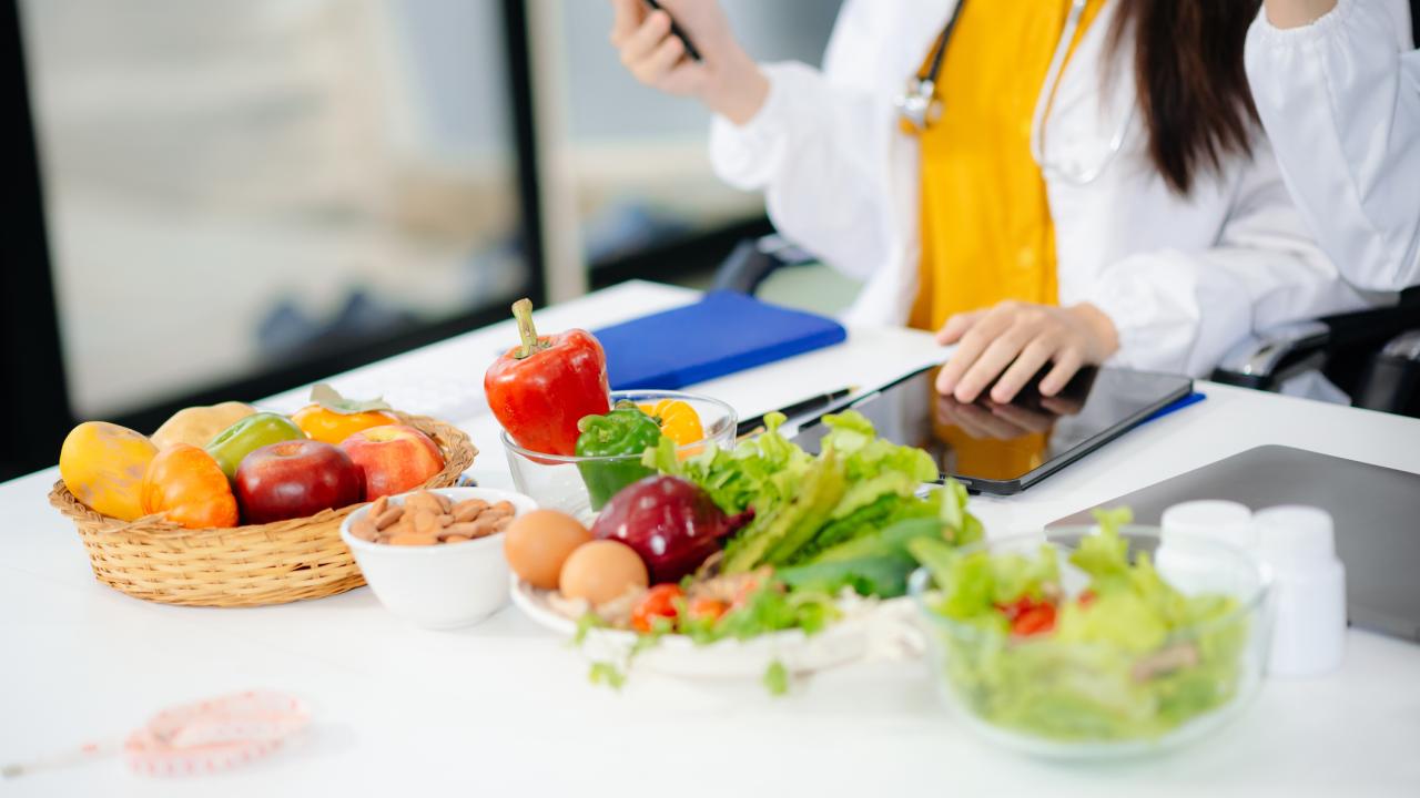 bowls of fruits and vegetables with a dietitian 