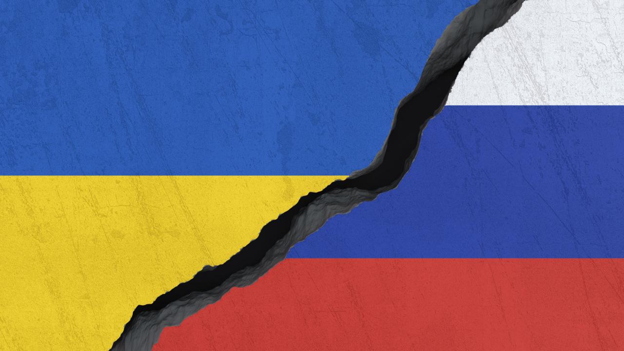 Flags of Ukraine and Russia, broken in the middle