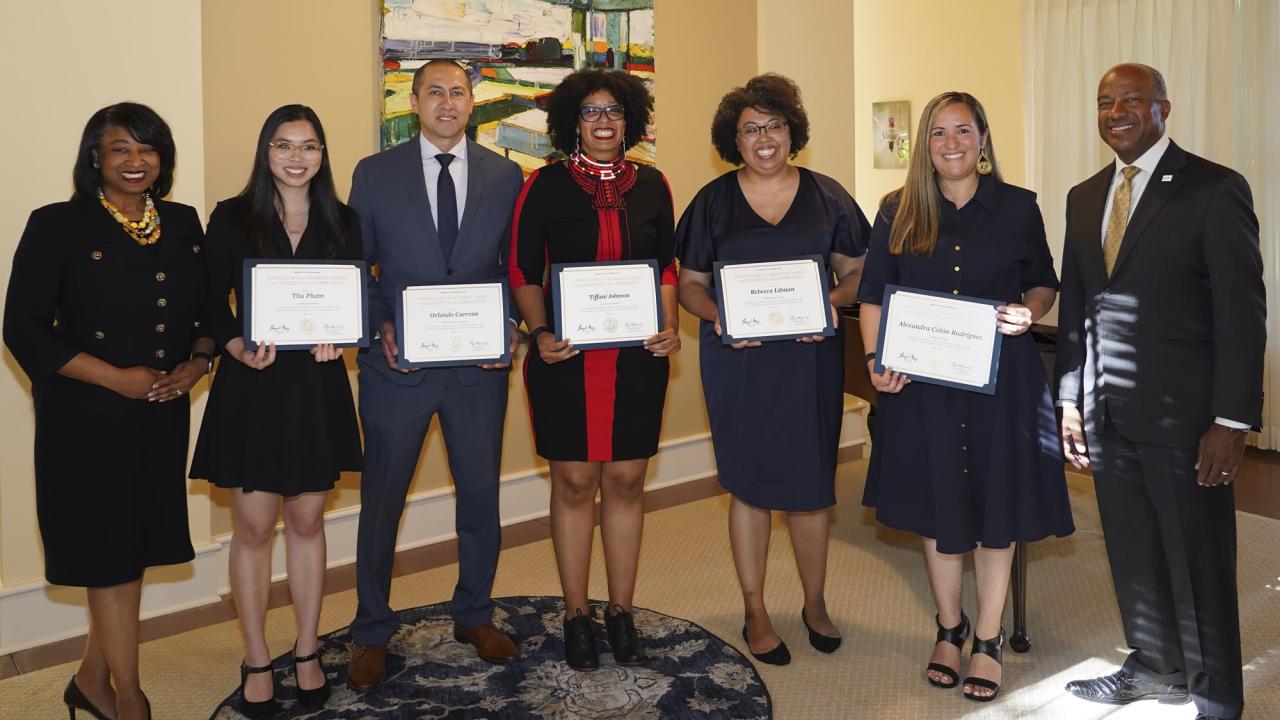 Group of award recipients, posed, in a line